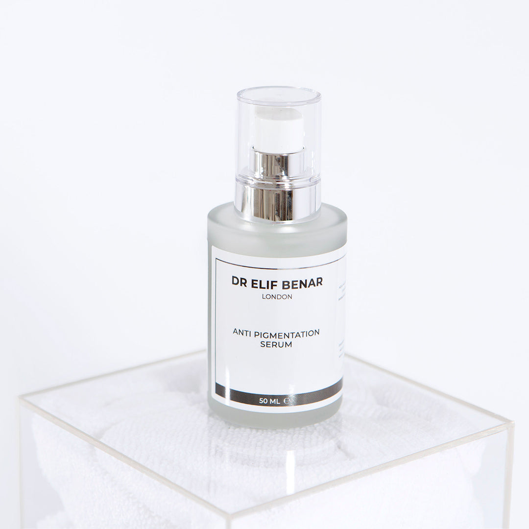 Dr Elif Benar Anti Pigmentation Serum 30ml pump bottle on a clear acrylic stand, serum for dark spots and uneven skin tone