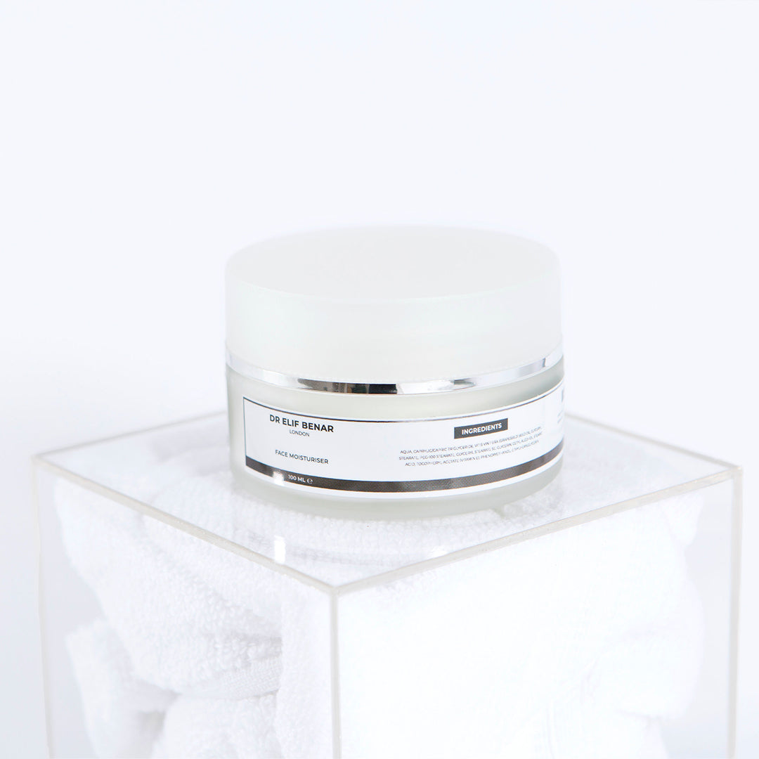 Dr Elif Benar Face Moisturiser jar on a clear acrylic cube, hydrating cream for dry and sensitive skin