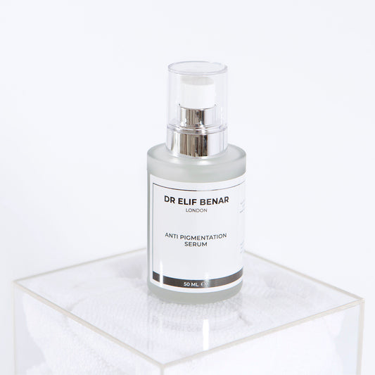 Dr Elif Benar Anti Pigmentation Serum 30ml pump bottle on a clear acrylic stand, serum for dark spots and uneven skin tone