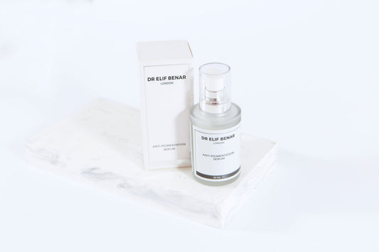 Dr Elif Benar Anti Pigmentation Serum 30ml bottle and box on a white marble block