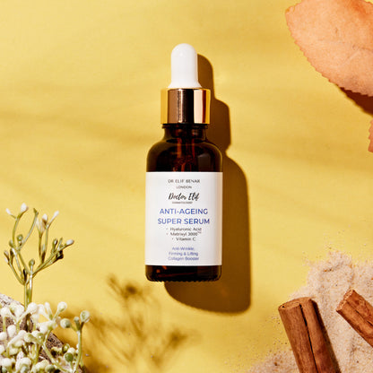 Dr Elif Benar Anti-Ageing Super Serum on a yellow background with flowers and natural props